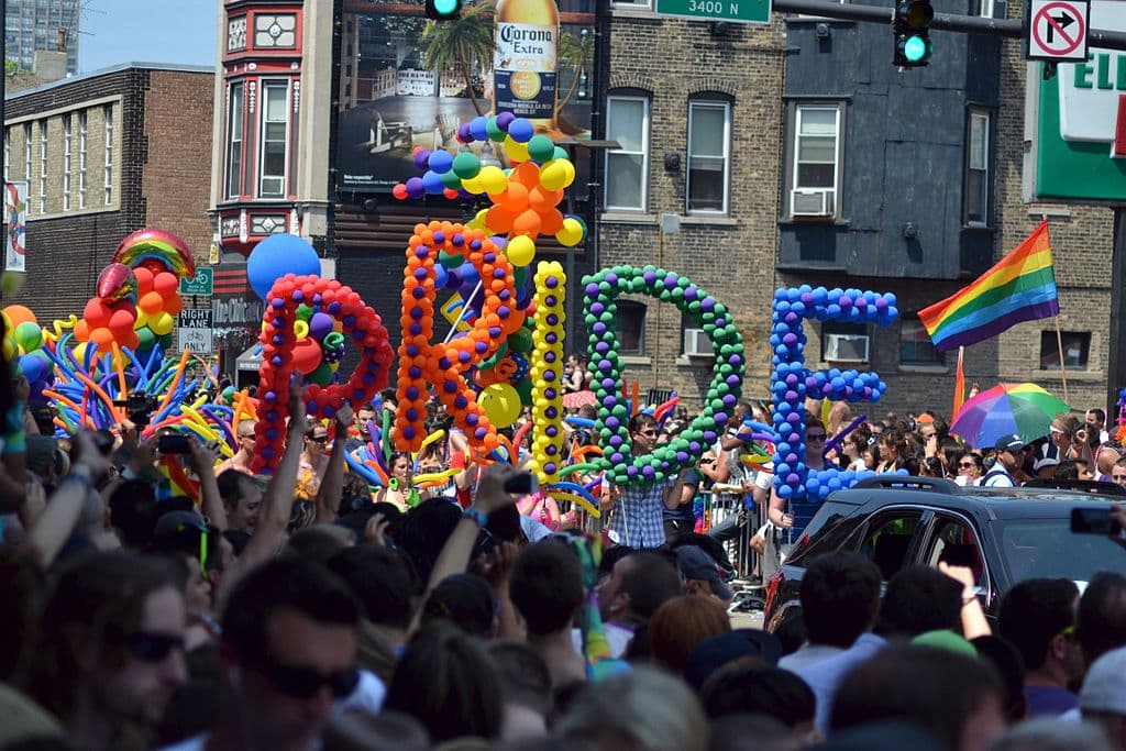 Rainbow colored balloons spelling "pride" during parade in Chicago