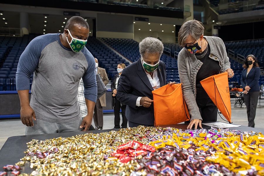 photo with Mayor Lori Lightfoot stuffing bags with candy