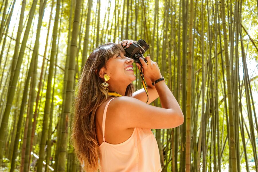 A woman shoots a photo on vacation