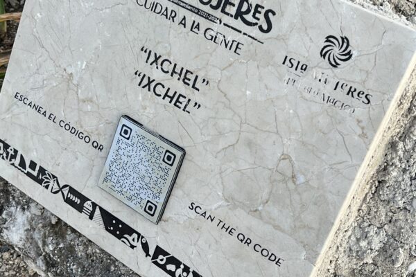2025 destination marketing trends toward technology and immersion are on display on statue pedestals showing QR codes that lead to historical descriptions. 